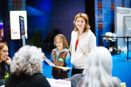 Girl Scout Brownie accompanied by their chaperone.